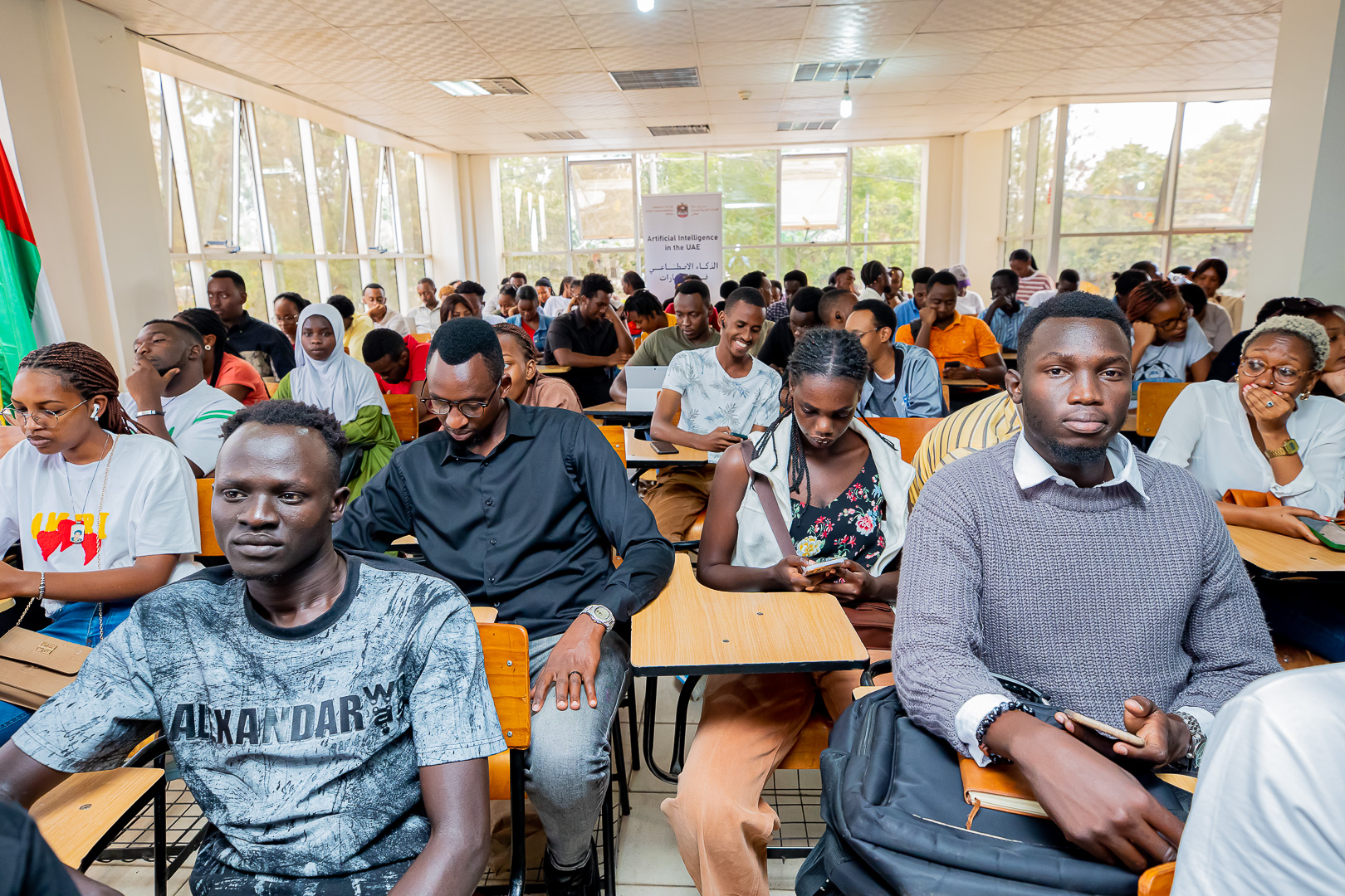 Students following presentations at the event.