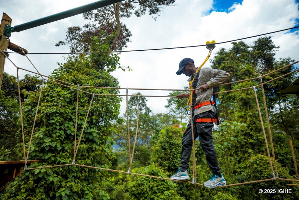 The visitor is safely secured to a rope that prevents any possibility of falling.         