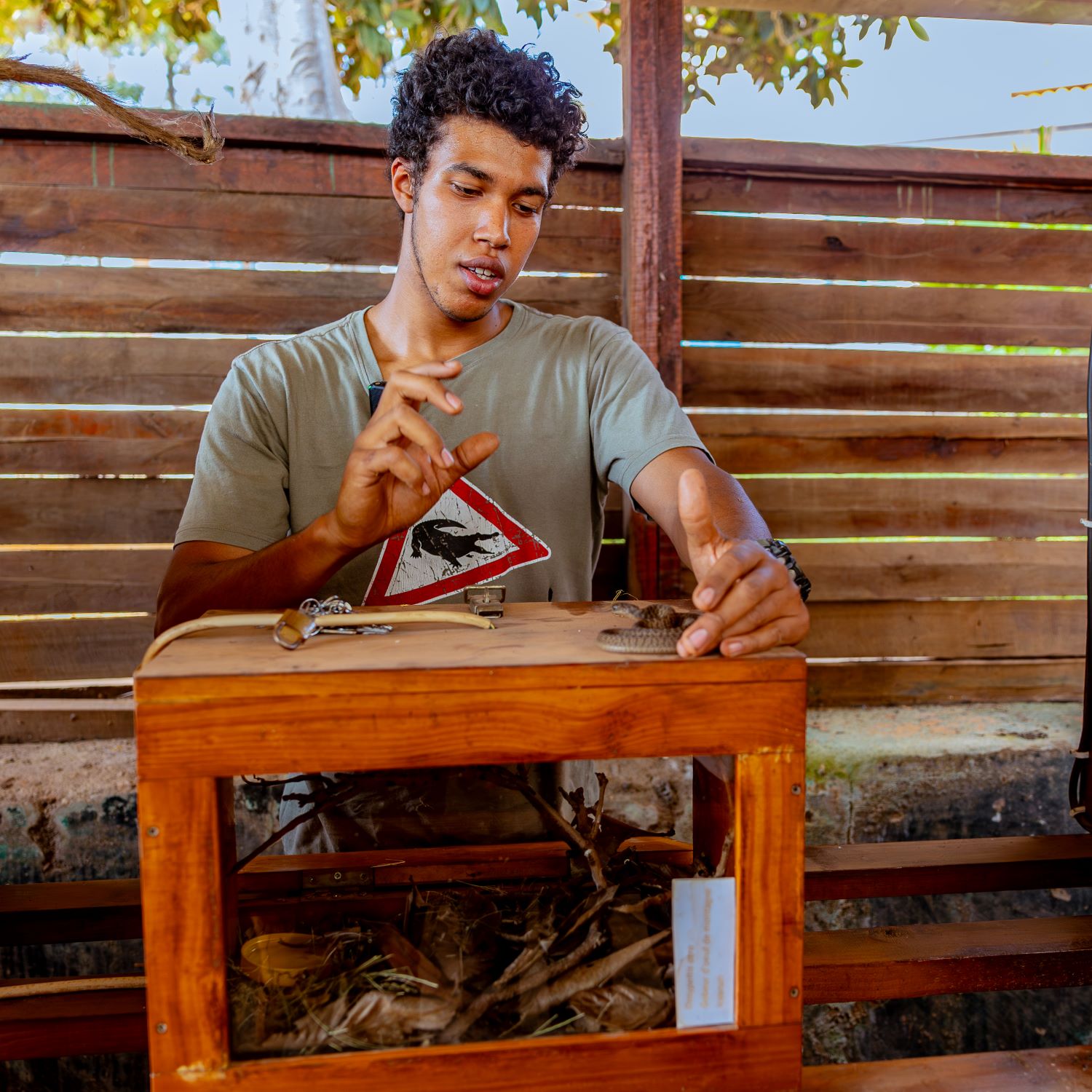 Hendrik Hinkel, a snake curator at the Richard Kandt House Museum, explains features and characteristics of an egg eater.