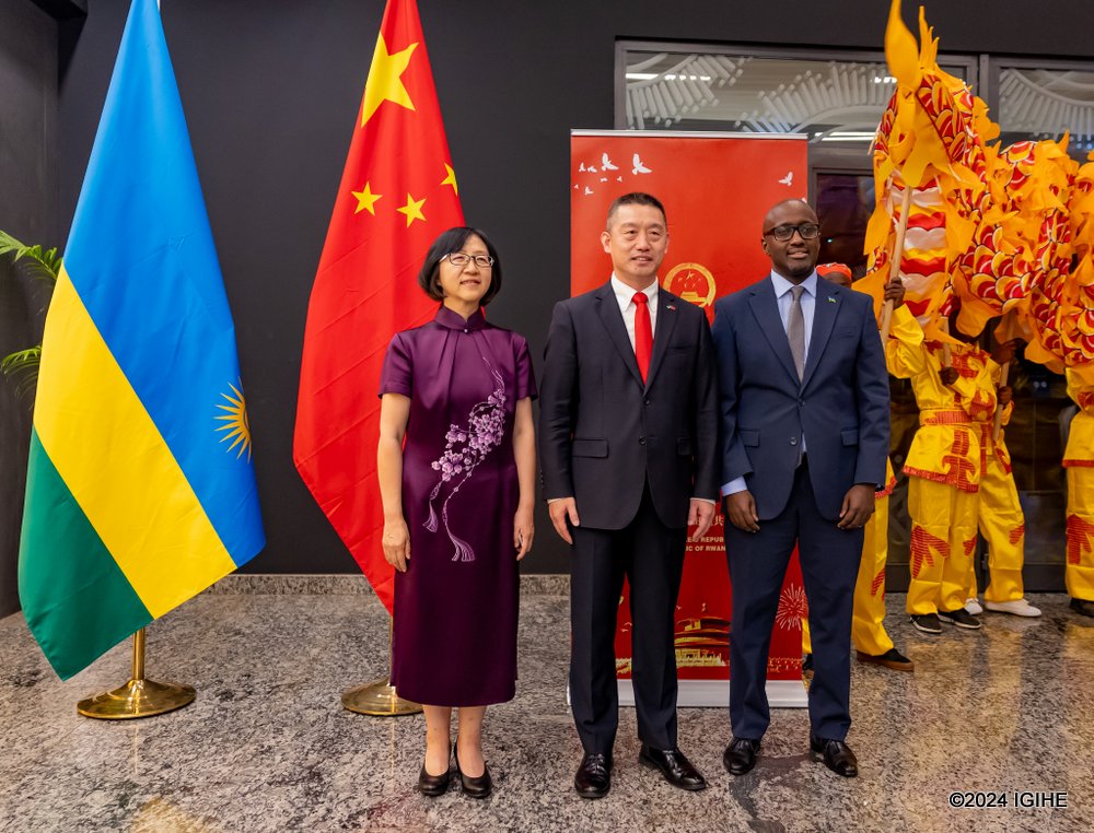 Minister Nduhungirehe with Ambassador Wang's family in a group photo at the event's venue.