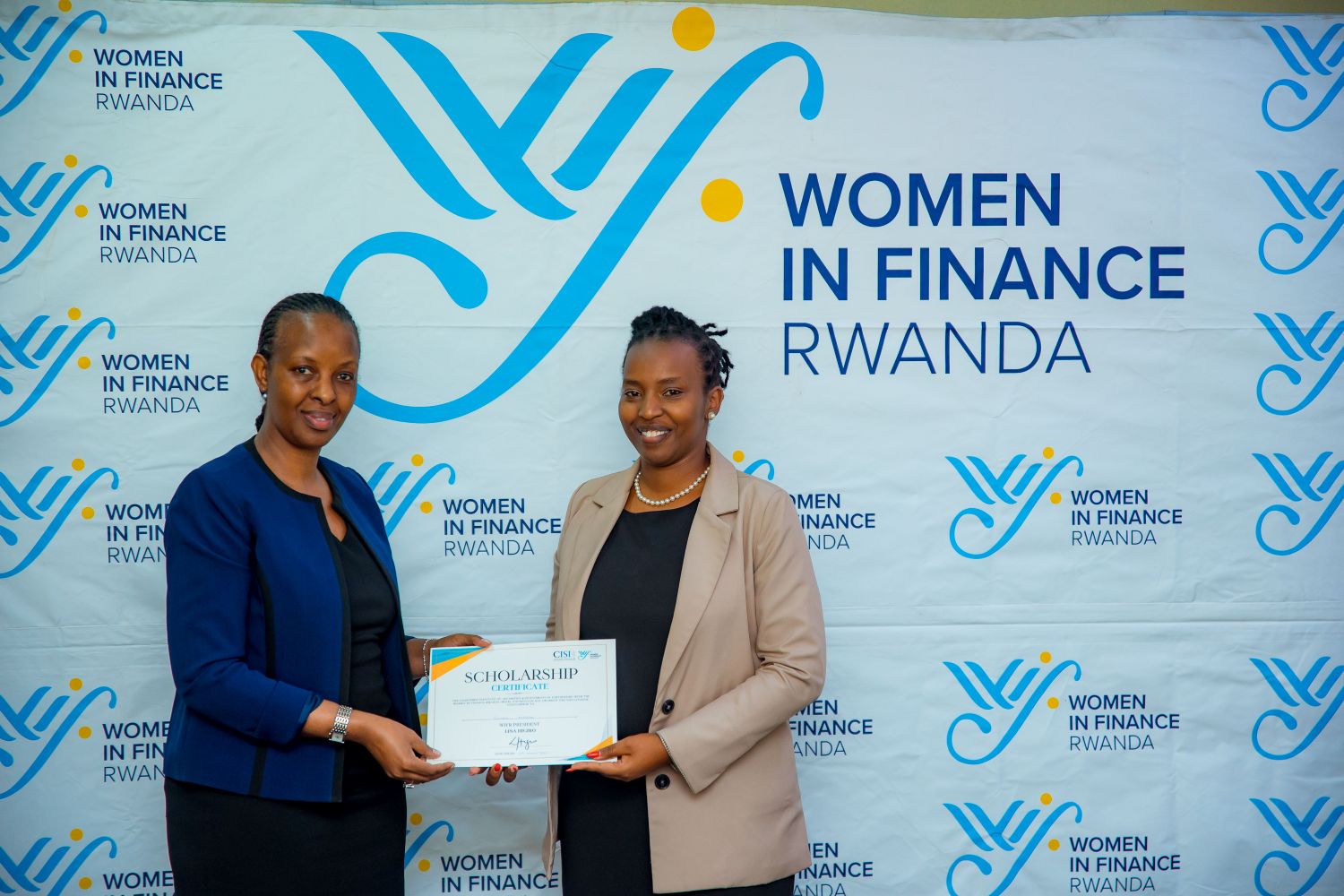 Esther Mugisha receives her scholarship award certificate.