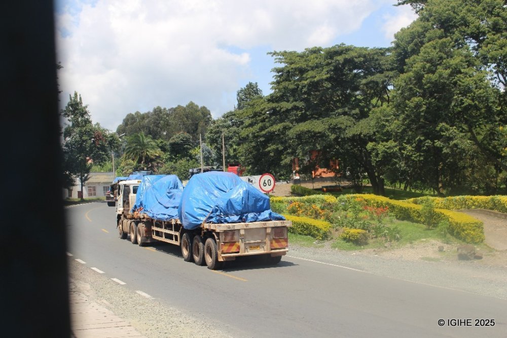 Approximately seven trucks carrying military equipment, accompanied by smaller vehicles with overseeing officials, were observed.