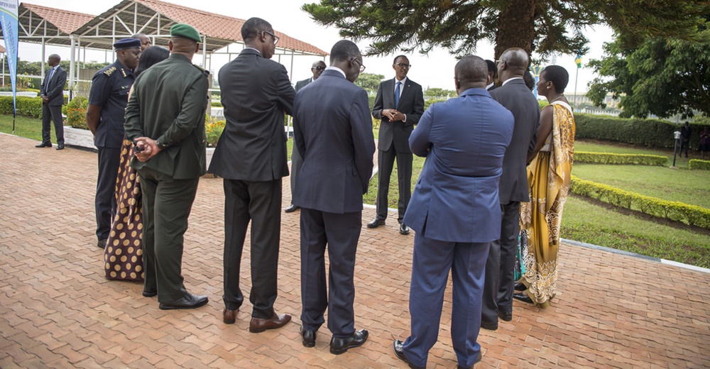 President Paul Kagame talking to government officials after laying wreaths at Heroes Square.