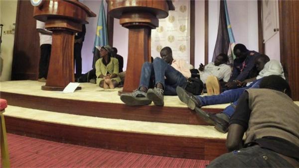 Journalists seen on the ground following sounds of gun shots inside the presidential compound