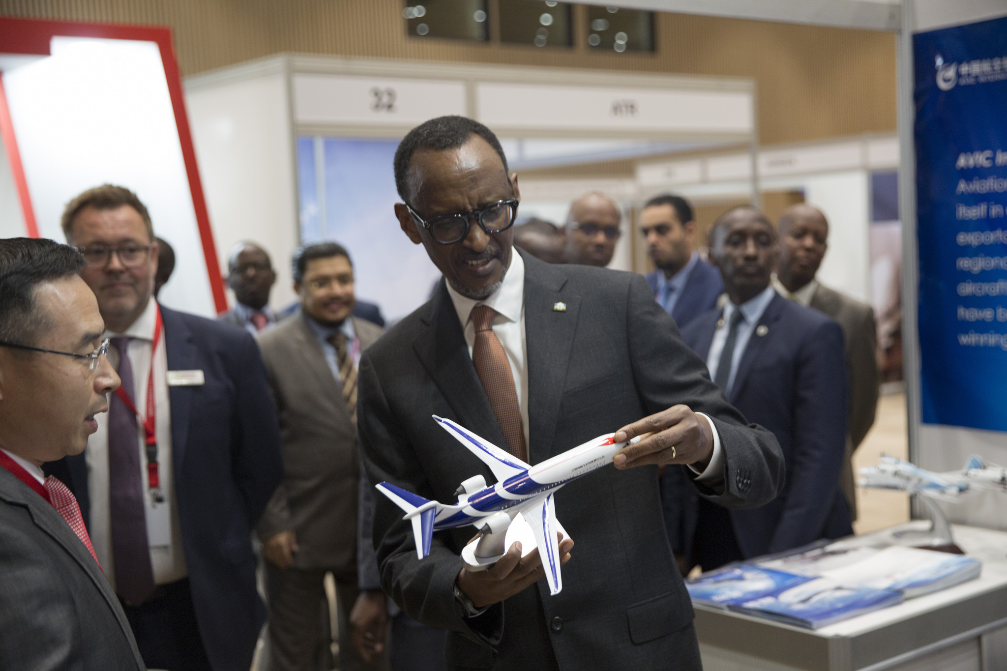 President Paul Kagame holding a model RwandaAir aircraft during the inauguration of Aviation Africa Conference in Kigali Convention Center.  