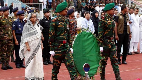 PM Hasina paid respects to the victims by visiting a stadium where their bodies were kept