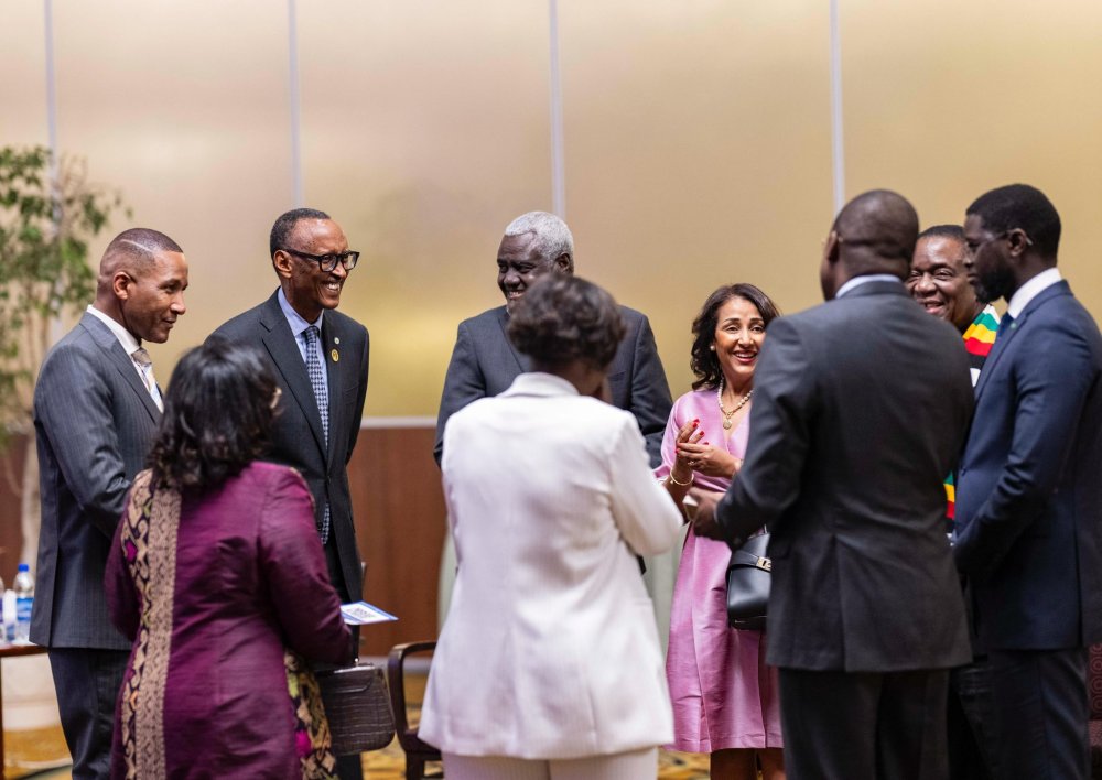 President Kagame sharing a light moment with other leaders.