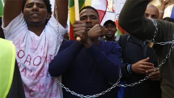 Ethiopian migrants, all members of the Oromo community of Ethiopia living in Malta, protest in Valletta, Malta, December 2015