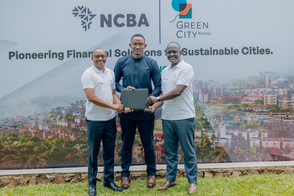 Jack Ngarambe, Director General of Urbanization, Housing, and Human Settlement at the Ministry of Infrastructure (in the middle) witnessed the signing of the landmark agreements.