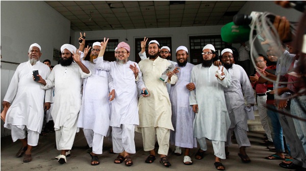 Leaders of the Qawmi madrasa-based organisation Hifazat-e Islam show victory sign after the high court ruling on the state religion of Bangladesh