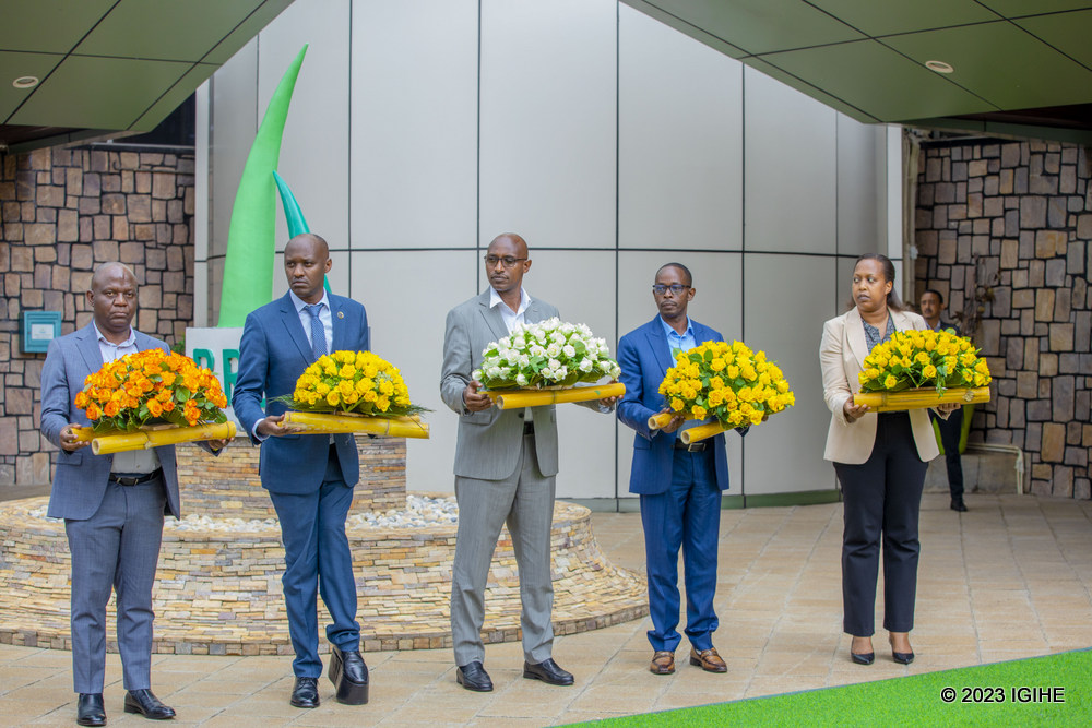Officials who attended the event holding wreaths to be laid at the memorial monument. 