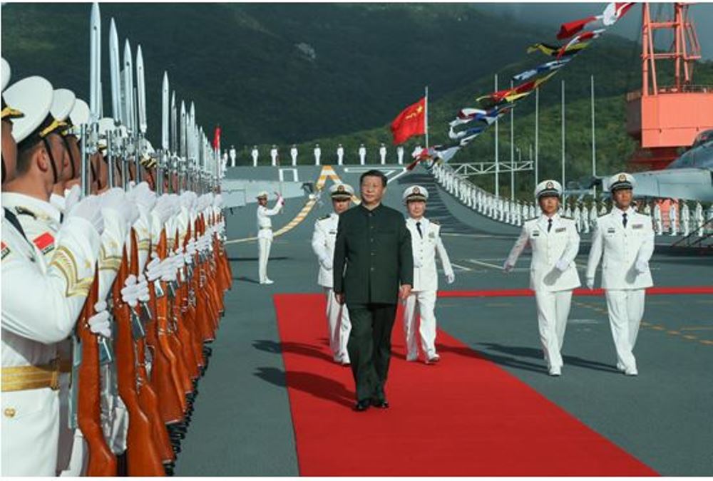 Xi Jinping boards the aircraft carrier Shandong and reviews the guard of honor at a naval port in Sanya, south China's Hainan Province, Dec. 17, 2019.  (Xinhua/Li Gang)