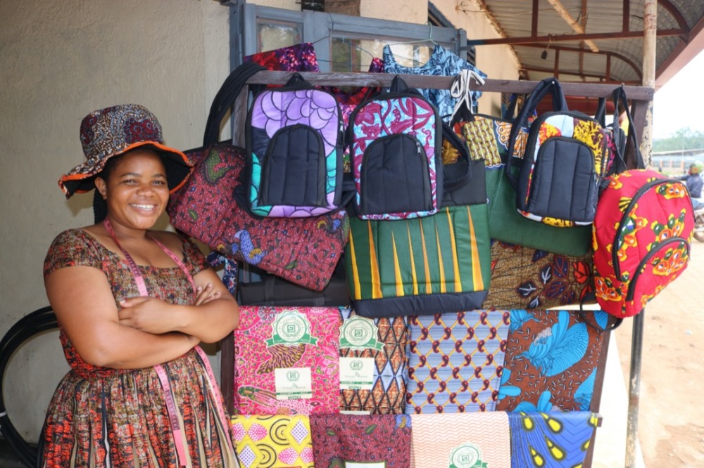 Aline MUNYANA and some of her products. Photo: APEFE