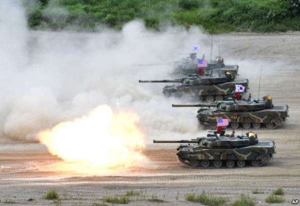 In this photo provided by the South Korean Defense Ministry, a South Korean marine K1 tank fires during a joint military exercise between South Korea and the United States in Pohang, South Korea, July 6, 2016.