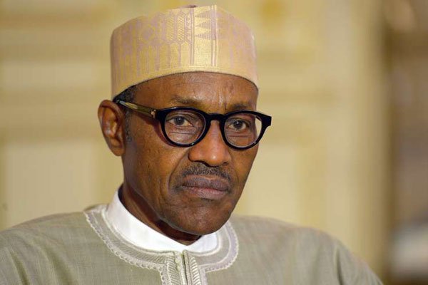 Nigerian President Muhammadu Buhari listening to a question from the press in Paris. Buhari leaves for Britain on Tuesday to seek treatment over an ear infection.