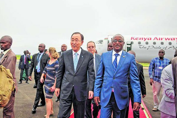 United Nations Secretary-General Ban Ki-Moon (left) walks with Burundi's Vice President Gaston Sindimwo at Bujumbura airport on February 22, 2016. The UN is weighing options of sending 3,000 police officers to Burundi.