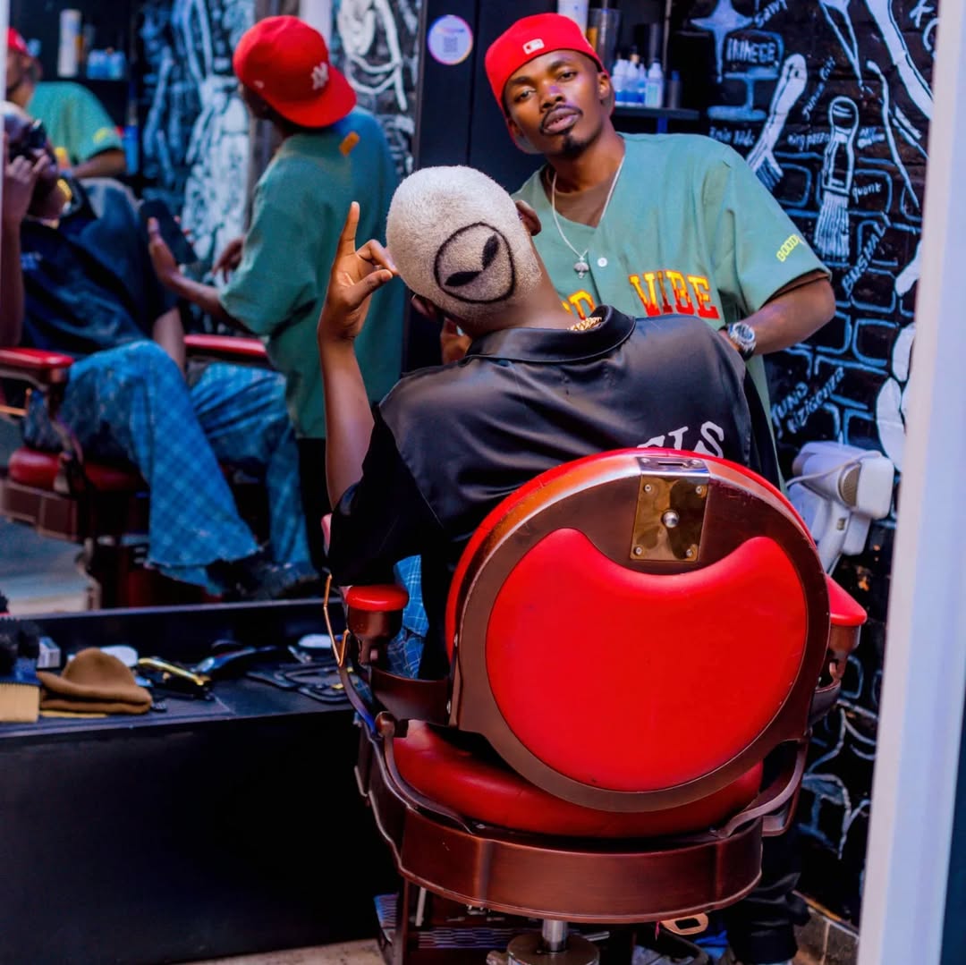 A barber in action at Kigali Clippers Zone.