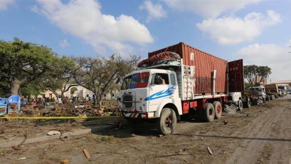 Trailers are seen parked outside a police cordon after the suicide car bomb went off