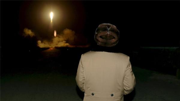 North Korean leader Kim Jong Un watches a ballistic rocket launch drill in March