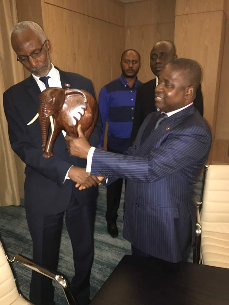 RPF  Inkotanyi Secretary General, Ngarambe François receiving a gift from his counterpart of PCT, Pierre Ngolo