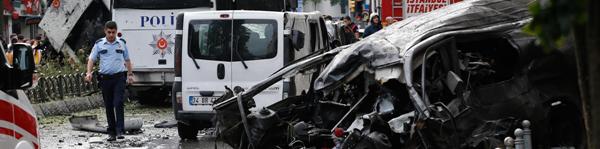 The explosion, caused by a car bomb, targeted a police bus, local media reported