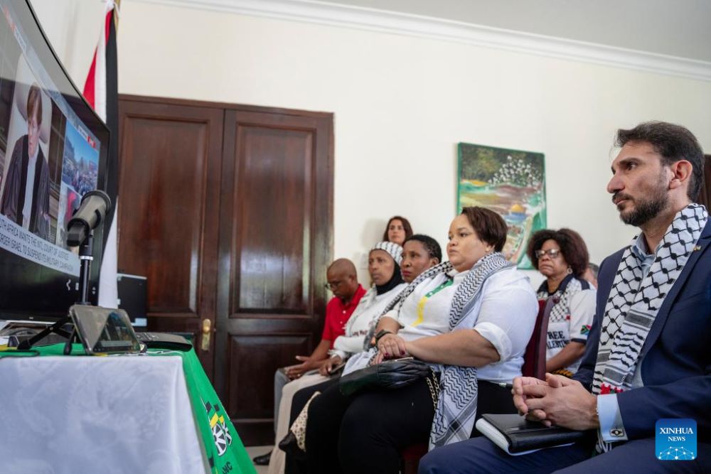 People watch the International Court of Justice (ICJ)'s ruling of the case against Israel in The Hague, in Pretoria, South Africa, on Jan. 26, 2024. South African President Cyril Ramaphosa said on Friday that the country welcomes the measures that the International Court of Justice (ICJ) ordered by majority decision, which ordered Israel to take all possible measures to prevent genocide acts in the Gaza Strip. On Dec. 29, 2023, South Africa filed an application to the ICJ for proceedings against Israel, concerning alleged violations by Israel of its obligations under the Convention of Genocide related to Palestinians in the Gaza Strip. (Photo by Ihsaan Haffejee/Xinhua)