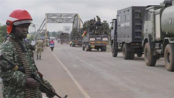 Ugandan forces cross a bridge in Elegu, Uganda, just south of the border with South Sudan