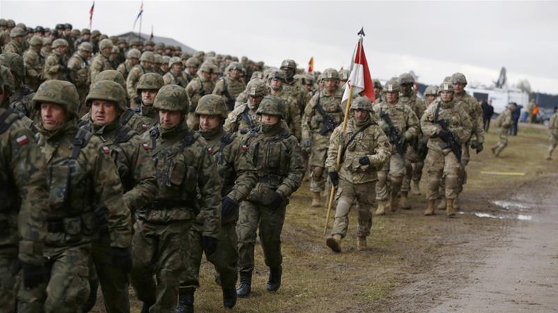 Polish and US soldiers attend a welcoming ceremony for NATO troops near Orzysz on Thursday