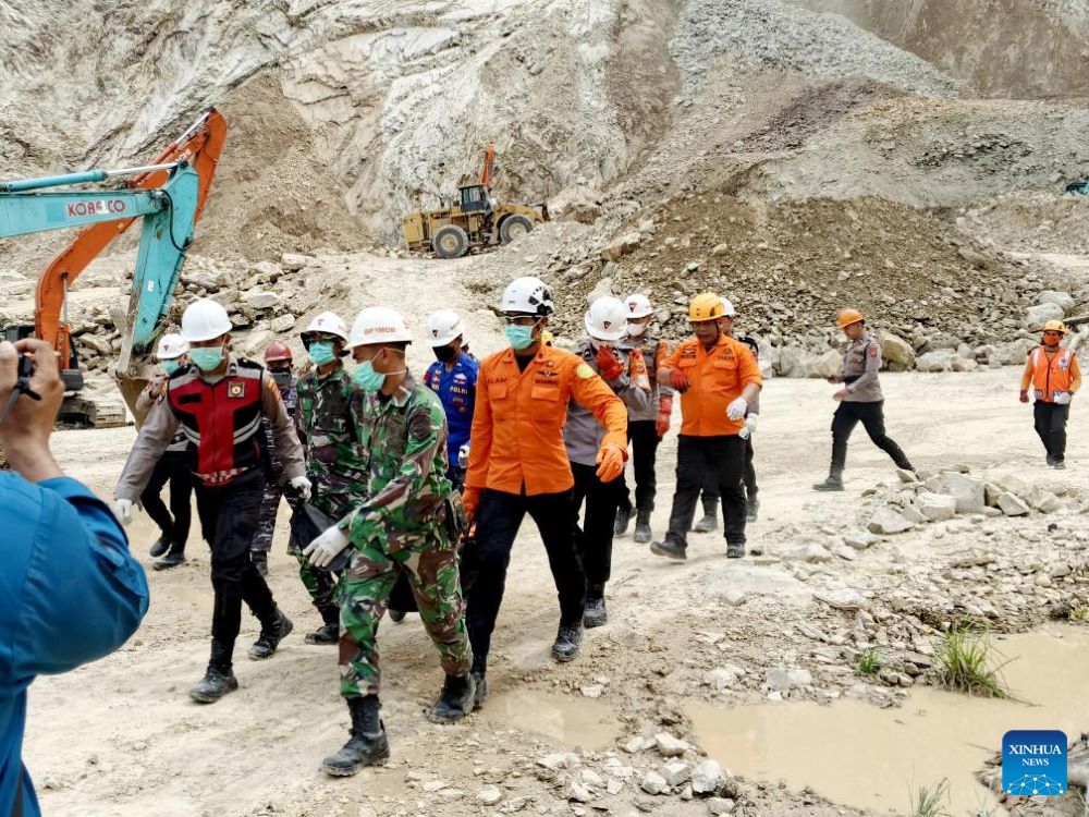 This photo provided by Indonesia's National Search and Rescue Agency (BASARNAS) shows rescuers transferring the body of a victim on the site of landslides at a quarry in Cirebon, West Java, Indonesia, June 1, 2025. (BASARNAS/Handout via Xinhua)