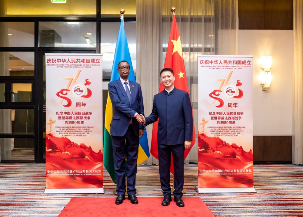 The Chinese Ambassador to Rwanda, Gao Wenqi welcoming Gen (Rtd) Kabarebe as he arrived at the event's venue.