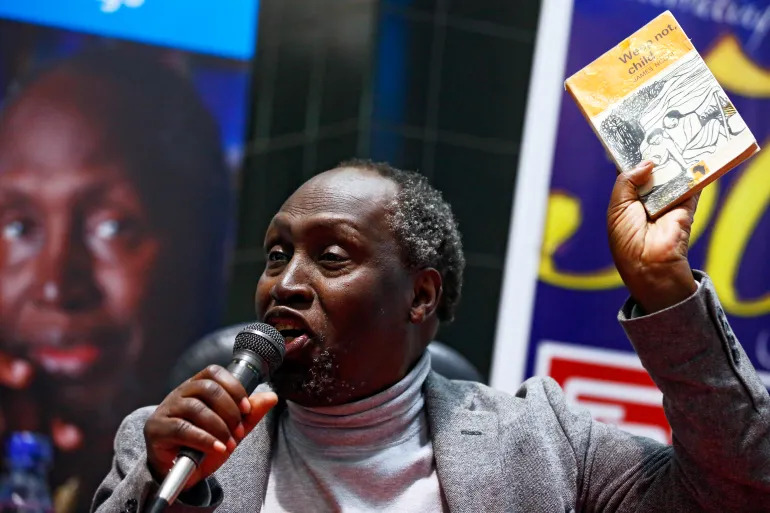 Ngũgĩ wa Thiong’o holds up a copy of Weep Not, Child during a 2015 book signing in Nairobi. Published in 1964, it was the first novel in English by an East African.