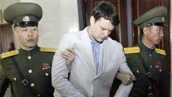 Otto Warmbier is escorted for sentencing to the Supreme Court in Pyongyang on Wednesday