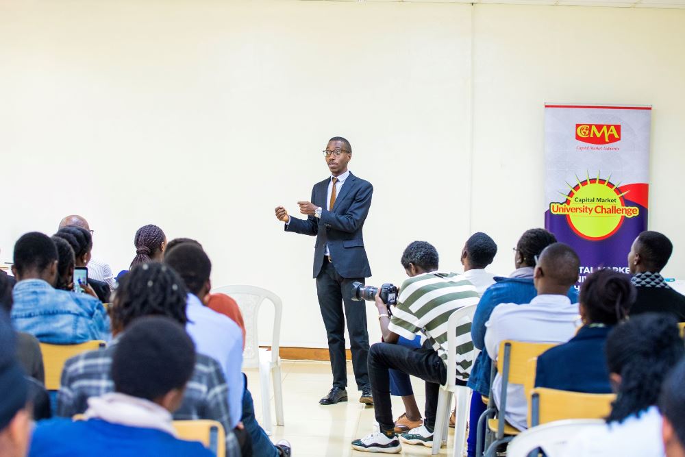 Magnifique Migisha, Coordinator of the Capital Market University Challenge speaking to students. 