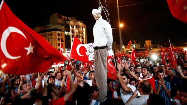 Protesters carry an effigy of opposition figure Fethullah Gulen during a demonstration in Istanbul on Monday evening