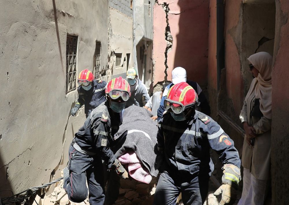 Rescuers carry the body of a victim near the epicenter at Amizmiz Village in Morocco, Sept. 10, 2023.(Xinhua/Wang Dongzhen)