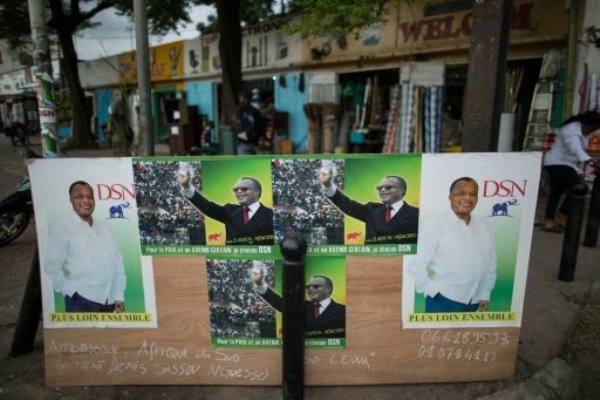 Electoral posters of incumbent Congolese President Denis Sassou-Nguesso are seen at a busy intersection in Brazzaville