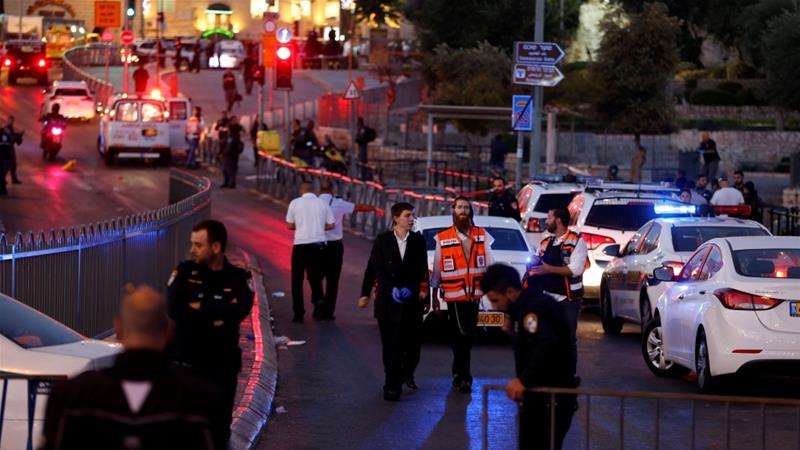 Israeli policemen secure the scene of the attack in occupied Jerusalem's Old City