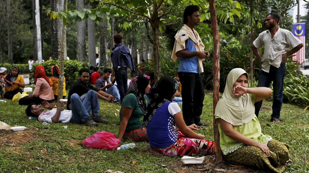 Refugees, many of whom say they are Rohingya, wait for access to the UNHCR office in Kuala Lumpur, Malaysi