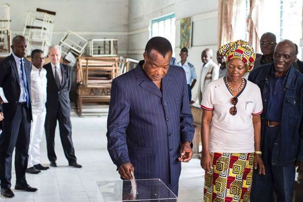Incumbent Congolese President Denis Sassou Nguesso casts his ballot at a polling station in Brazzaville on March 20, 2016.