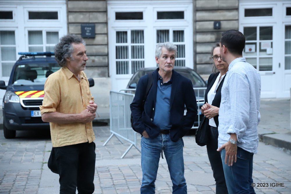 Enthusiasts about history of Genocide against the Tutsi including Bruce Clarke (left), chatting after the ruling.