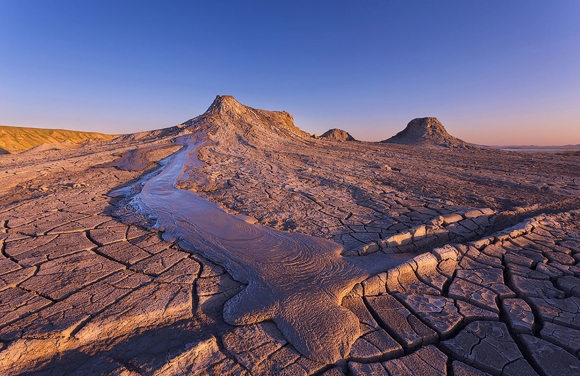 Azerbaijan is home to over 350 mud volcanoes, more than most countries, some of which erupt methane and mud dramatically.