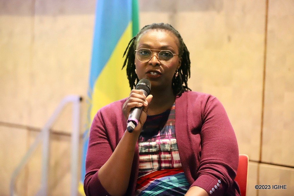 Sophia Mukamana van Heesewijk delivering a talk. 