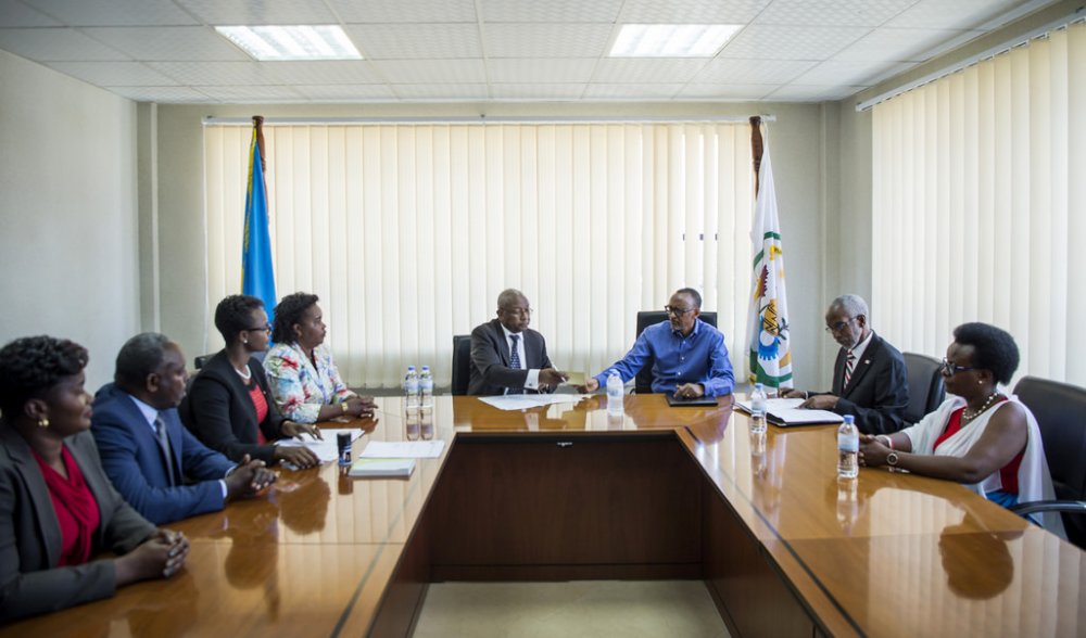 President Paul Kagame presented his credentials to NEC Chairman, Prof. Kalisa Mbanda in the presence of RPF Inkotanyi Secretary General, Ngarambe François (first right) and commissioner in FPR Inkotanyi (right), Mukasine Marie Claire (second right in Rwandan traditional attire).