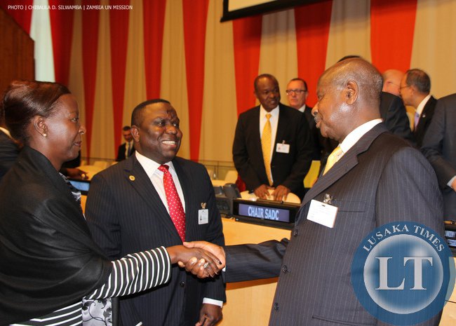 Uganda President Yoweri Museveni talking to Zambia Foreign Minister Harry Kalaba and Rwanda’s Foreign Ministers Louise Mushikiwabo at UN Headquarters on Monday 22-09-2014. PHOTO | CHIBAULA D. SILWAMBA | ZAMBIA UN MISSION