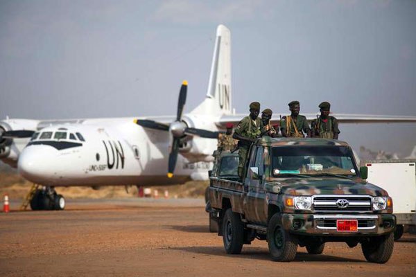 Some of the forty troop members of the Sudan People's Liberation Army in opposition (SPLA/M-IO) take a pick up truck after landing in a UN plane at Juba airport on March 28, 2016, as part of the peace agreement signed between rebel forces and the Government in August 2015.