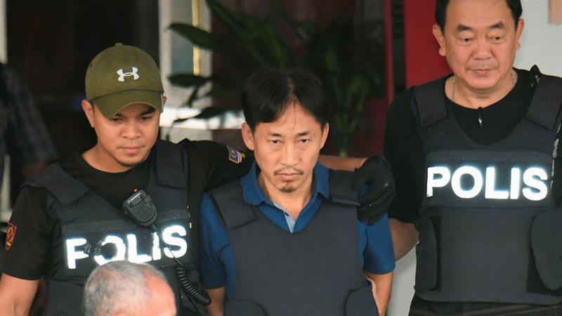 Suspect Ri Jong-chol leaves a Sepang police station to be deported on Friday