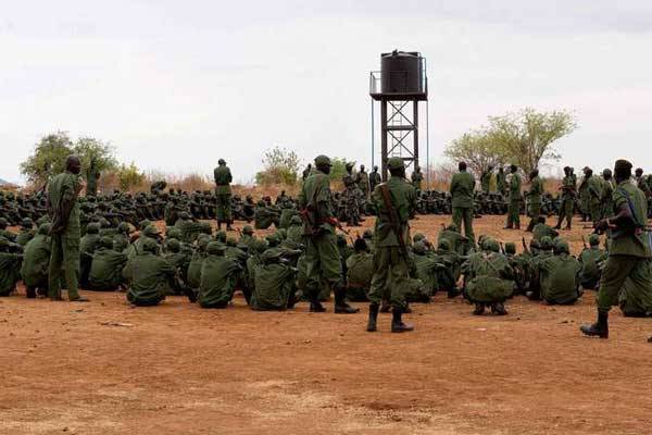 Sudan People's Liberation Army-in opposition (SPLA-io) soldiers gather at a containment site in the south Sudanese capital, Juba, on April 7, 2016.