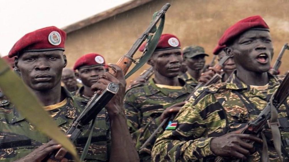 Presidential protection guards from South Sudan's People Defence Force (SSPDF) stand in a formation at their training site. (Photo by Reuters)