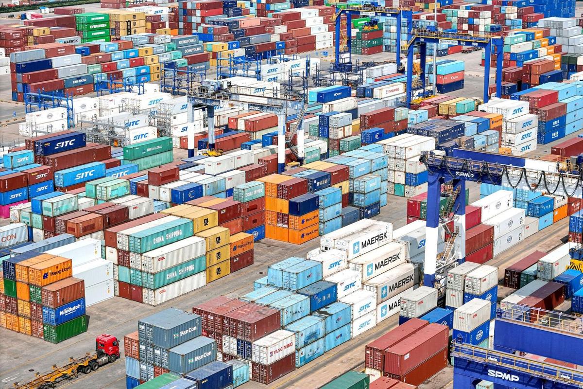 Shipping containers are stacked at a port in Yantai, in eastern China's Shandong province, on Thursday, April 3, 2025. China announced on Friday, April 4, 2025, that it will impose an additional 34% tariff on all U.S. imports starting April 10.