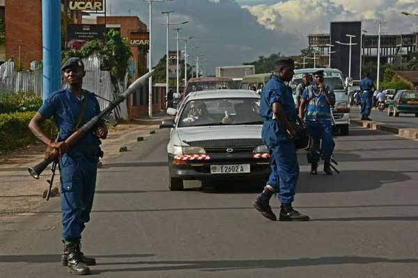Heavily armed police patrol the streets in Bujumbura on April 12, 2016. Burundi economy is in the doldrums amid a year-long political crisis that has driven a quarter million into exile.